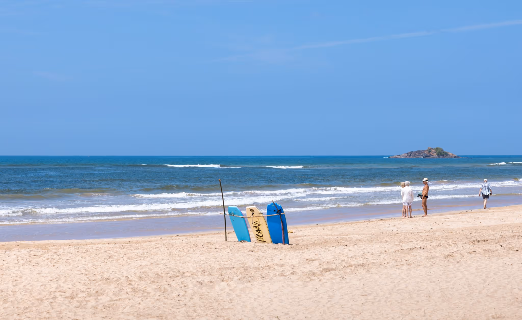 Golden sands and turquoise waters at Bentota Beach in Sri Lanka