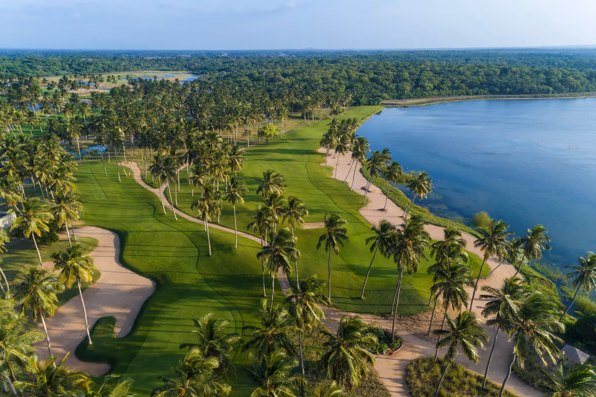 Championship golf course in the misty Sri Lankan highlands at golden hour
