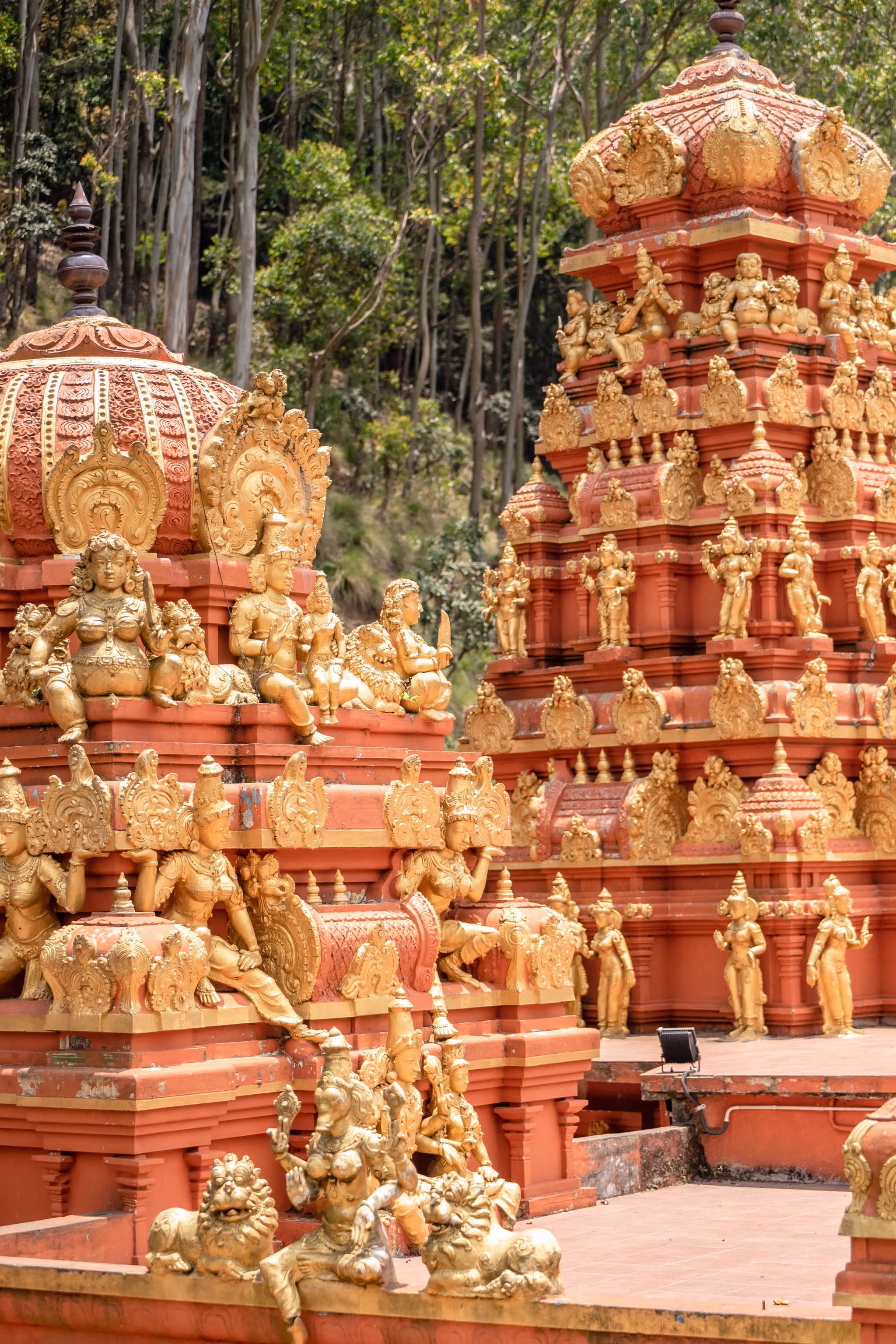 Colorful Seetha Amman Temple surrounded by the hills of Nuwara Eliya