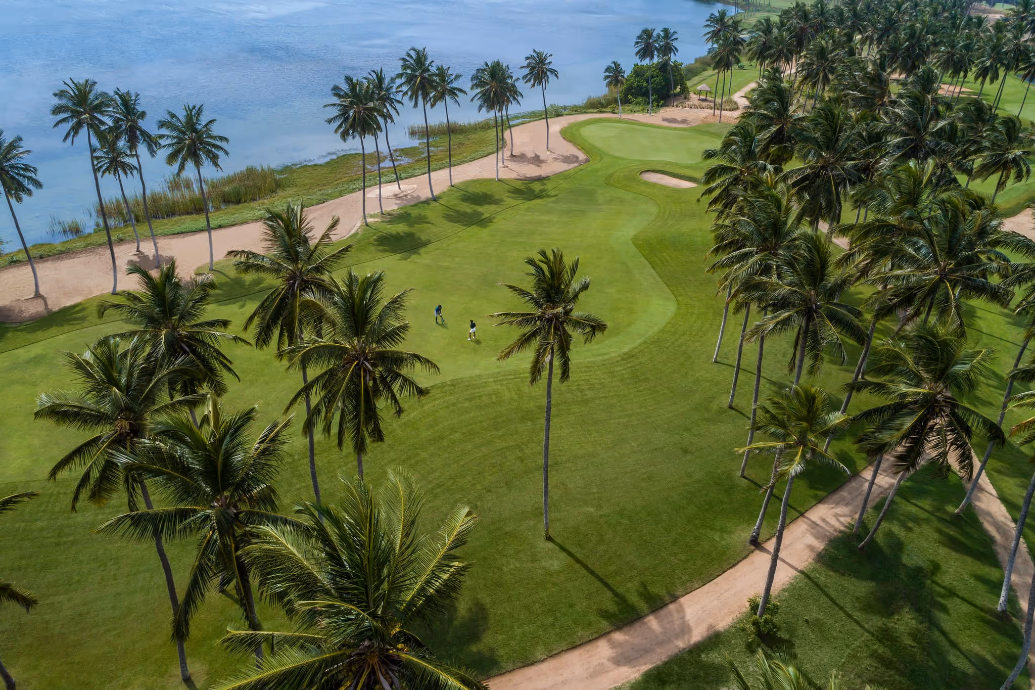 Golfers enjoying the championship course at Shangri-La Hambantota